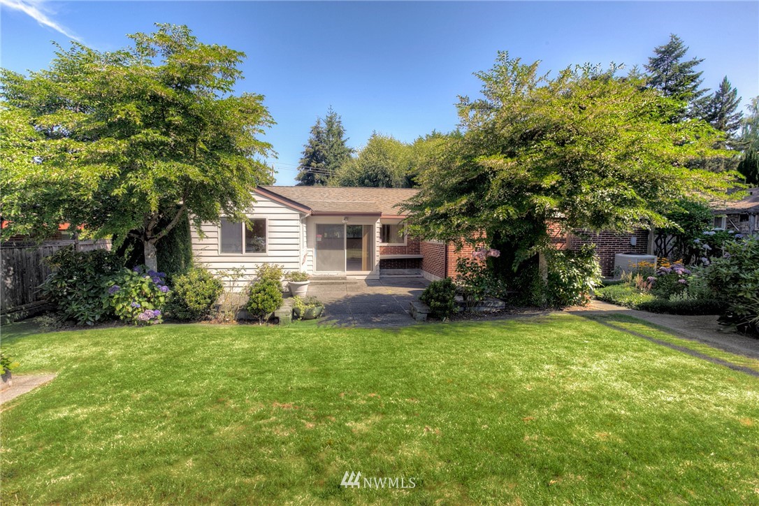619 Southwest Normandy Road Normandy Park, WA 98166 - Photo 24 of 24 a view of a house with a backyard