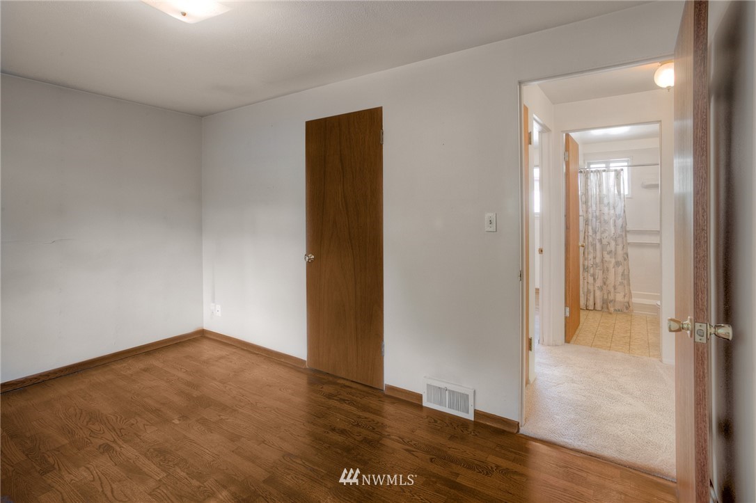 619 Southwest Normandy Road Normandy Park, WA 98166 - Photo 9 of 24 wooden floor in an empty room