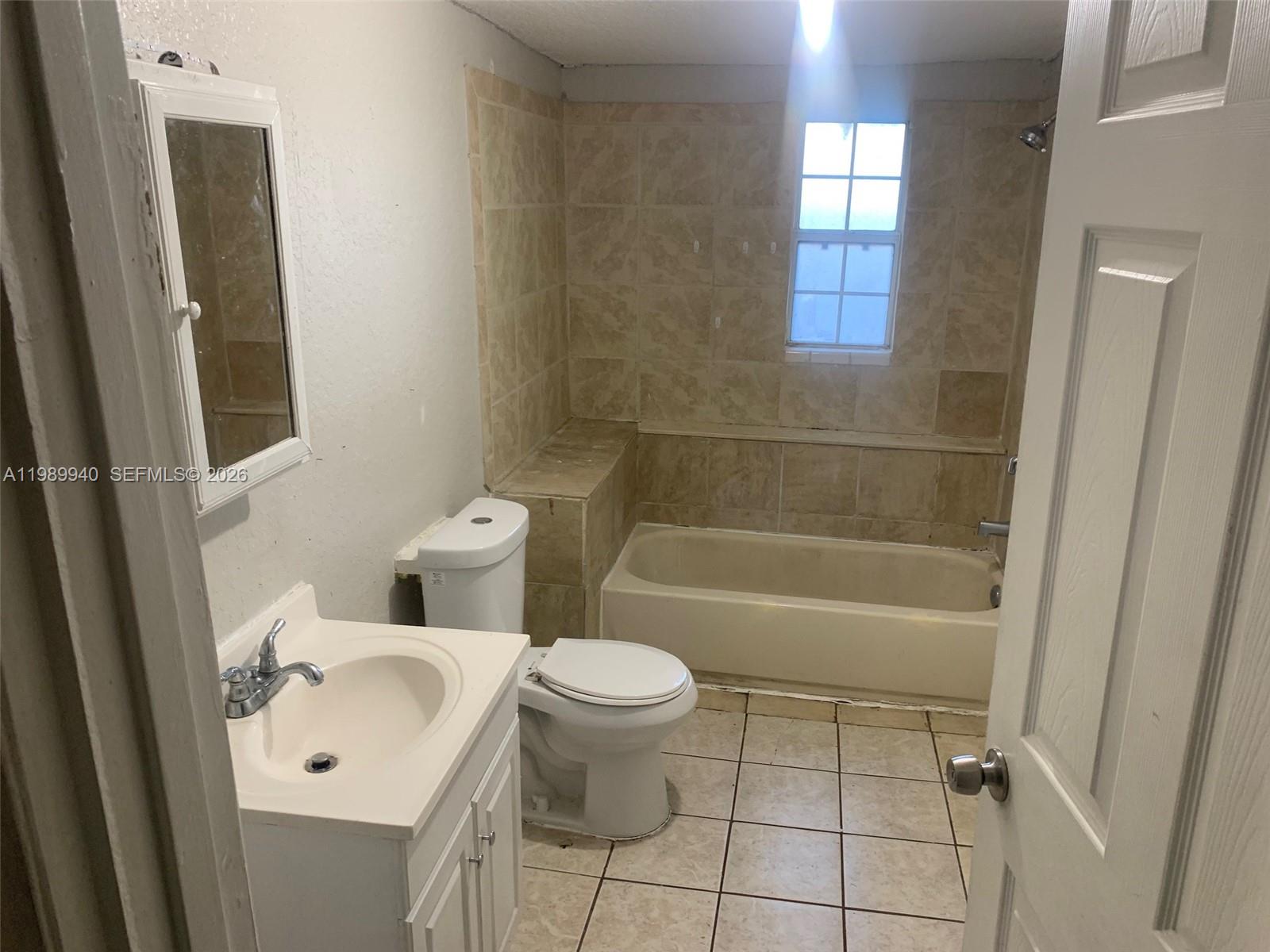 1129 Grothe Street Jacksonville, FL 32209 - Photo 15 of 21 a bathroom with a sink a toilet and shower