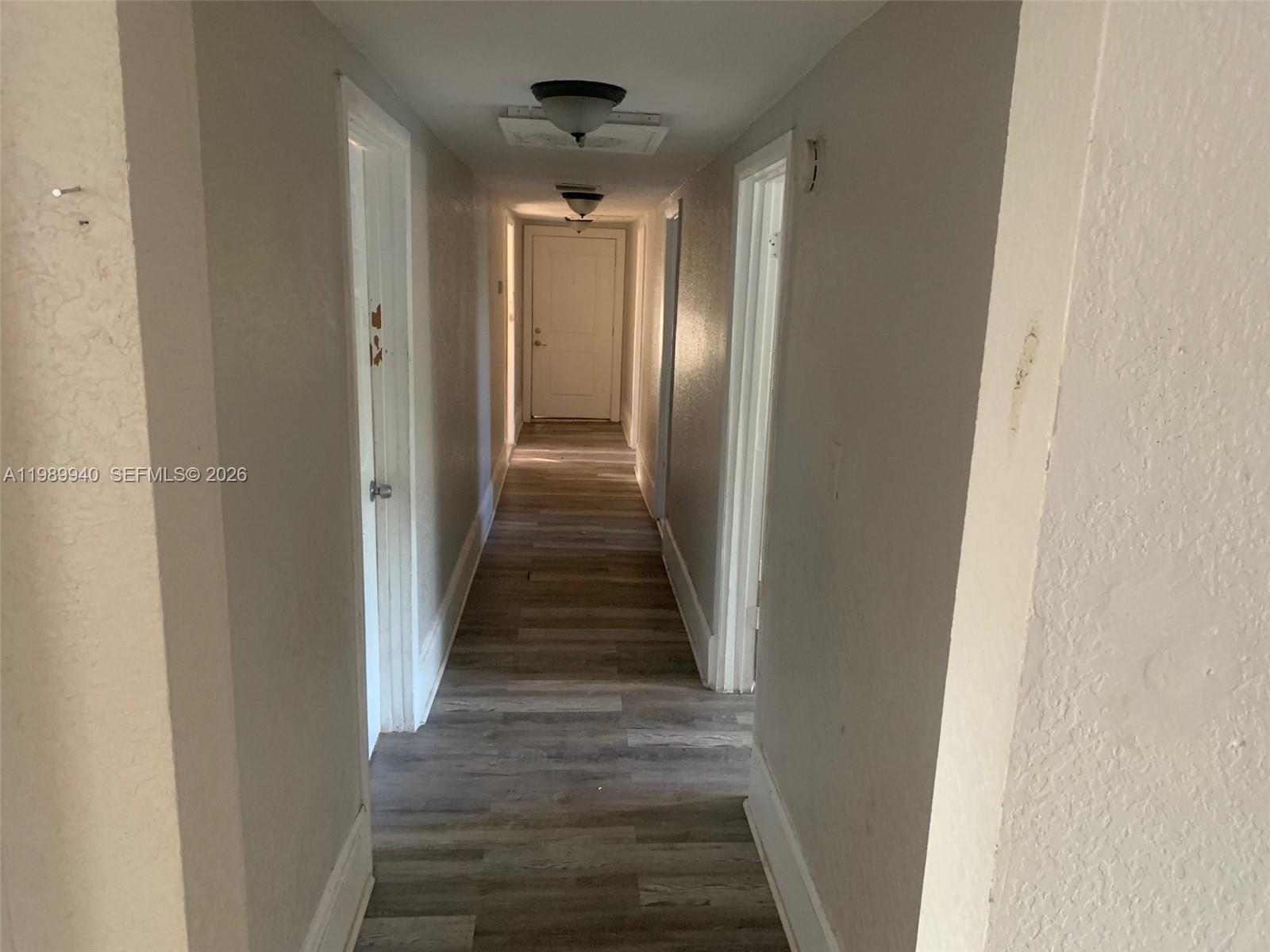 1129 Grothe Street Jacksonville, FL 32209 - Photo 18 of 21 a view of a hallway with wooden floor and staircase