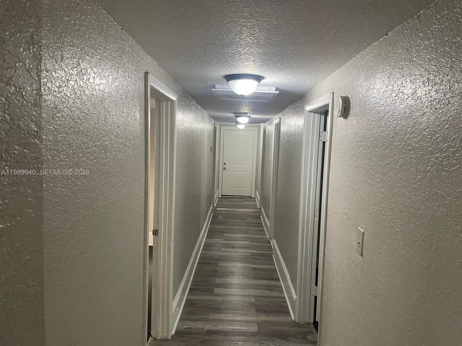 1129 Grothe Street Jacksonville, FL 32209 - Photo 3 of 21 a view of a hallway with wooden floor