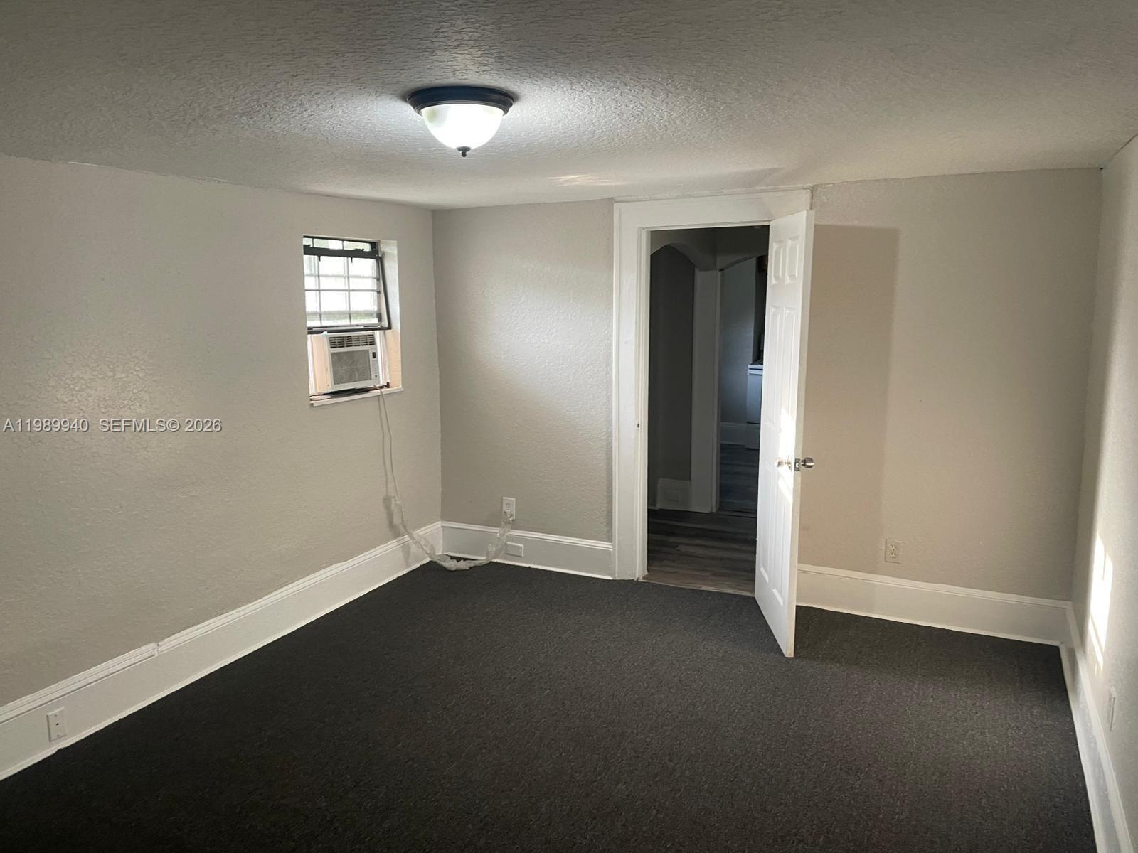 1129 Grothe Street Jacksonville, FL 32209 - Photo 4 of 21 an empty room with a empty space and windows