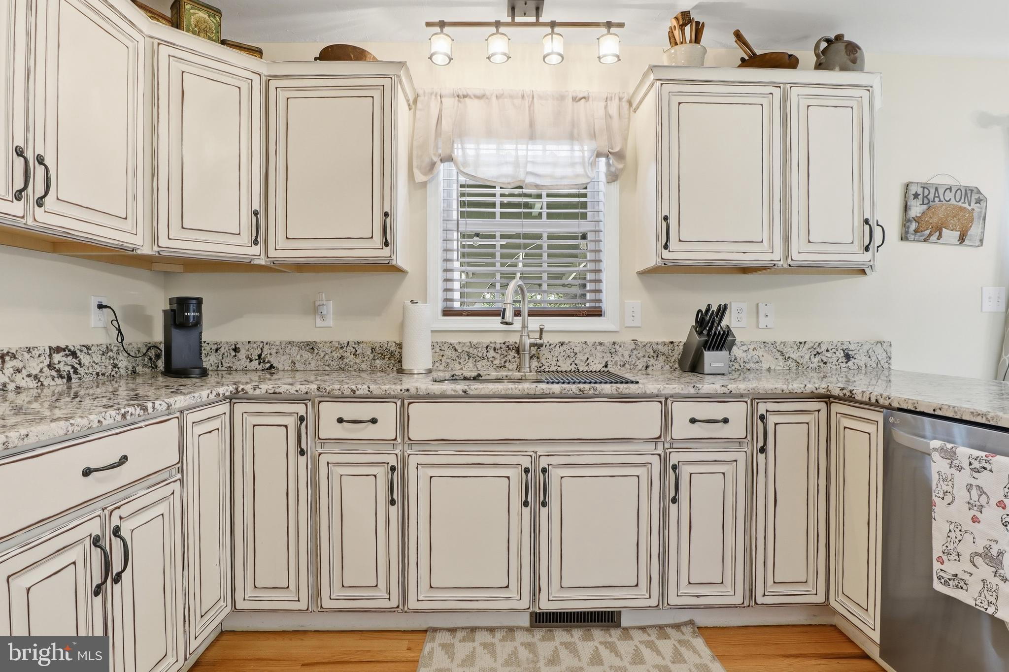 6083 Jennifer Lane Spring Grove, PA 17362 - Photo 13 of 61 a kitchen with granite countertop white cabinets and sink