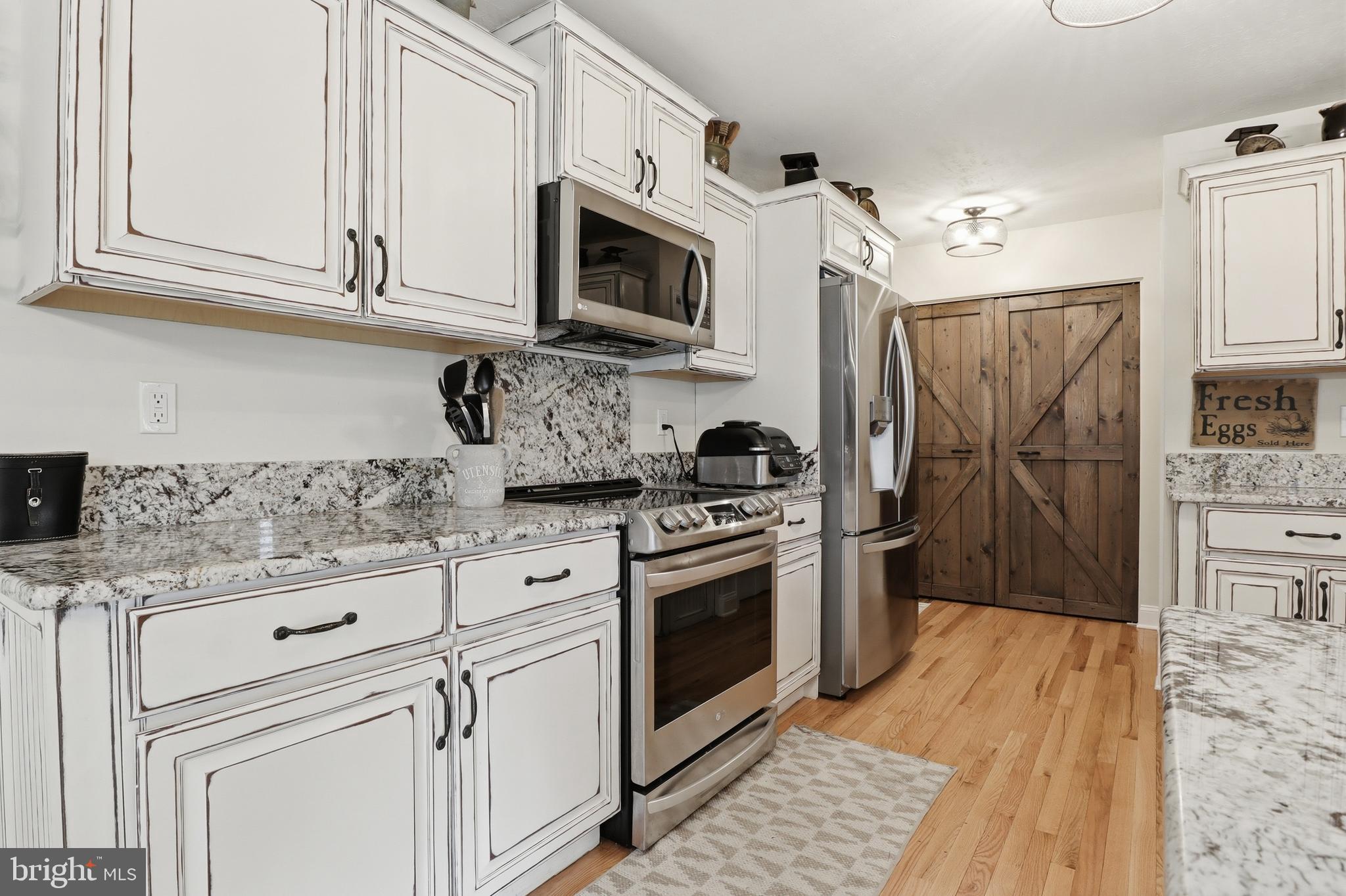 6083 Jennifer Lane Spring Grove, PA 17362 - Photo 14 of 61 a kitchen with stainless steel appliances granite countertop a refrigerator stove and sink