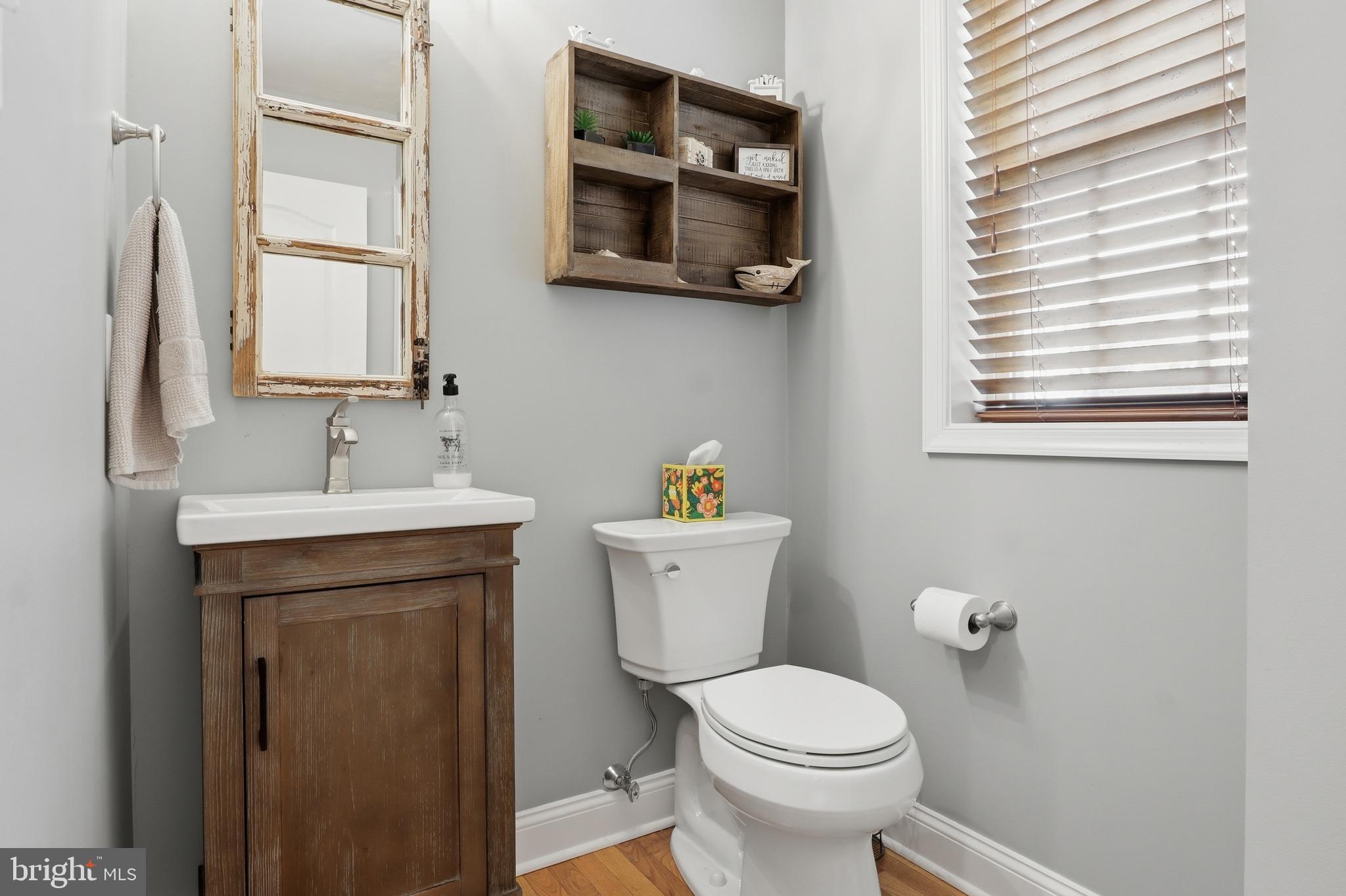 6083 Jennifer Lane Spring Grove, PA 17362 - Photo 20 of 61 a bathroom with a toilet a sink and mirror