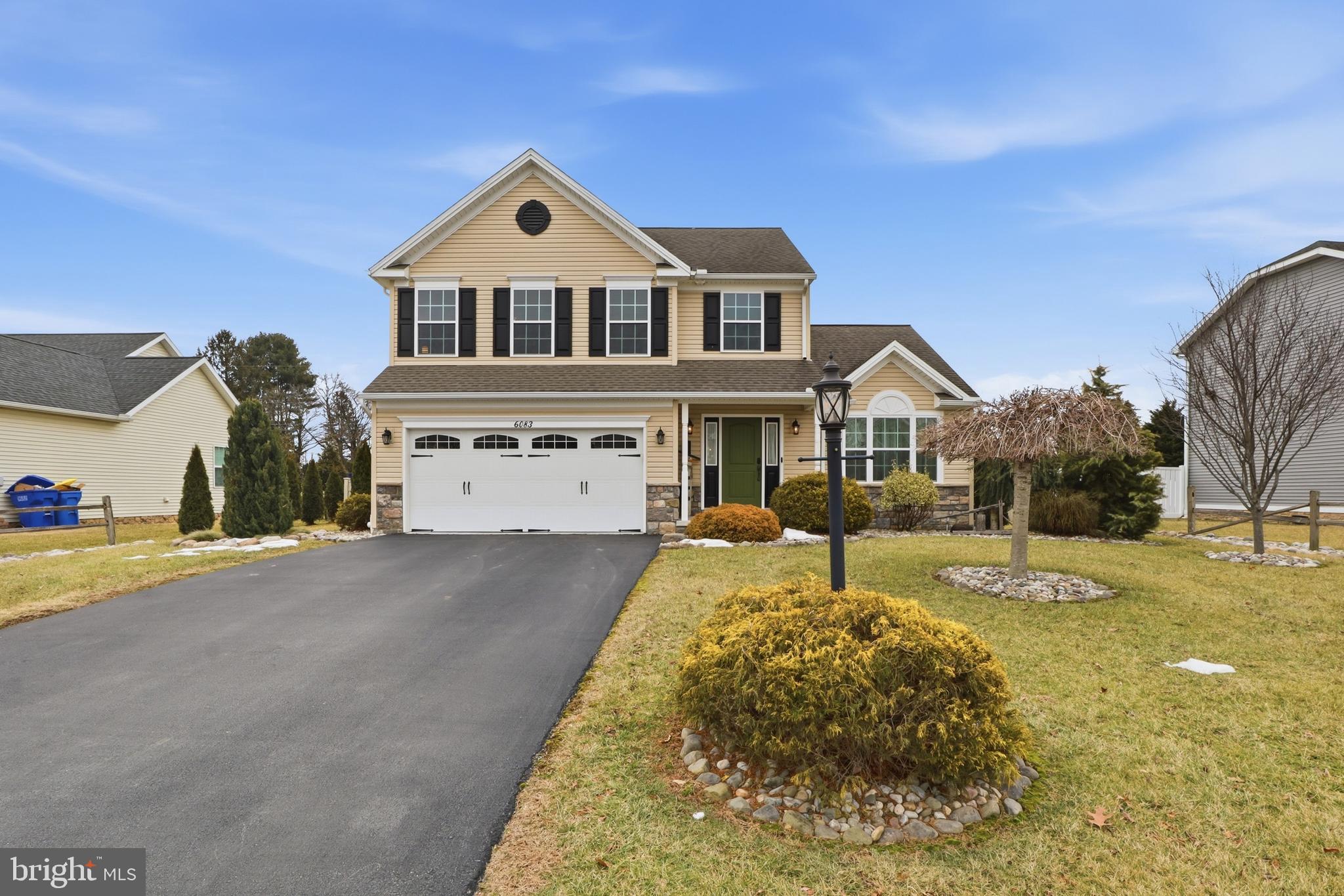 6083 Jennifer Lane Spring Grove, PA 17362 - Photo 2 of 61 a front view of a house with a yard