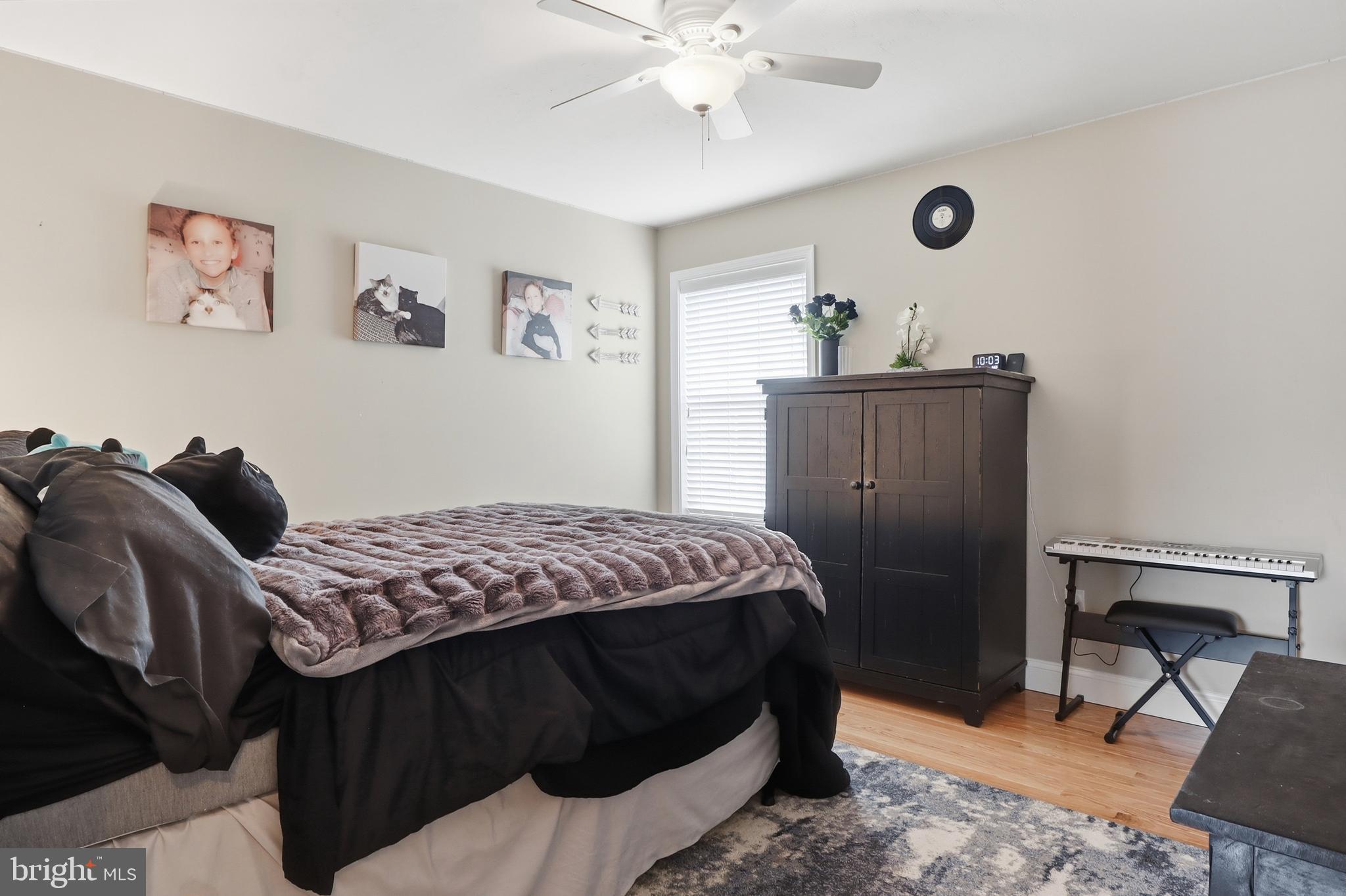 6083 Jennifer Lane Spring Grove, PA 17362 - Photo 25 of 61 a bedroom with a bed and a chandelier