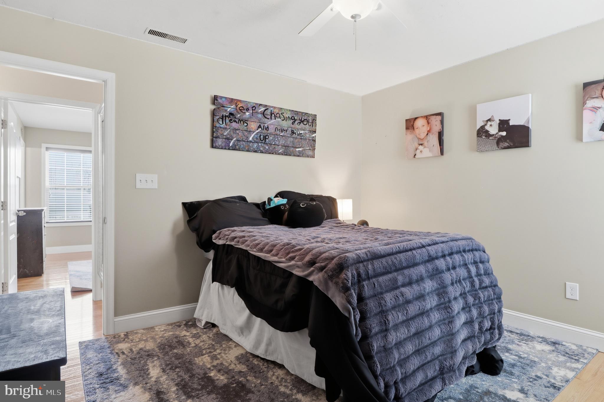 6083 Jennifer Lane Spring Grove, PA 17362 - Photo 26 of 61 a bedroom with a bed and wooden floor