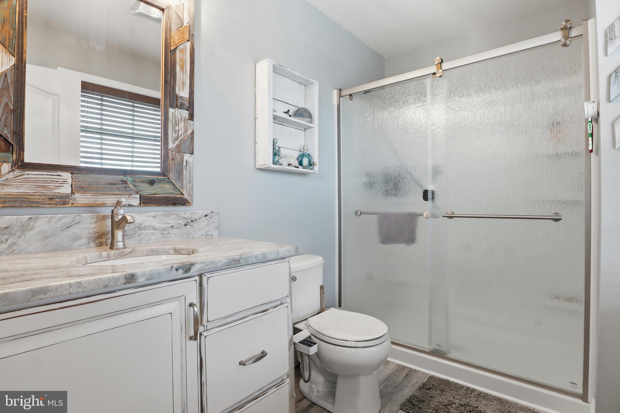 6083 Jennifer Lane Spring Grove, PA 17362 - Photo 32 of 61 a bathroom with a granite countertop sink toilet and shower