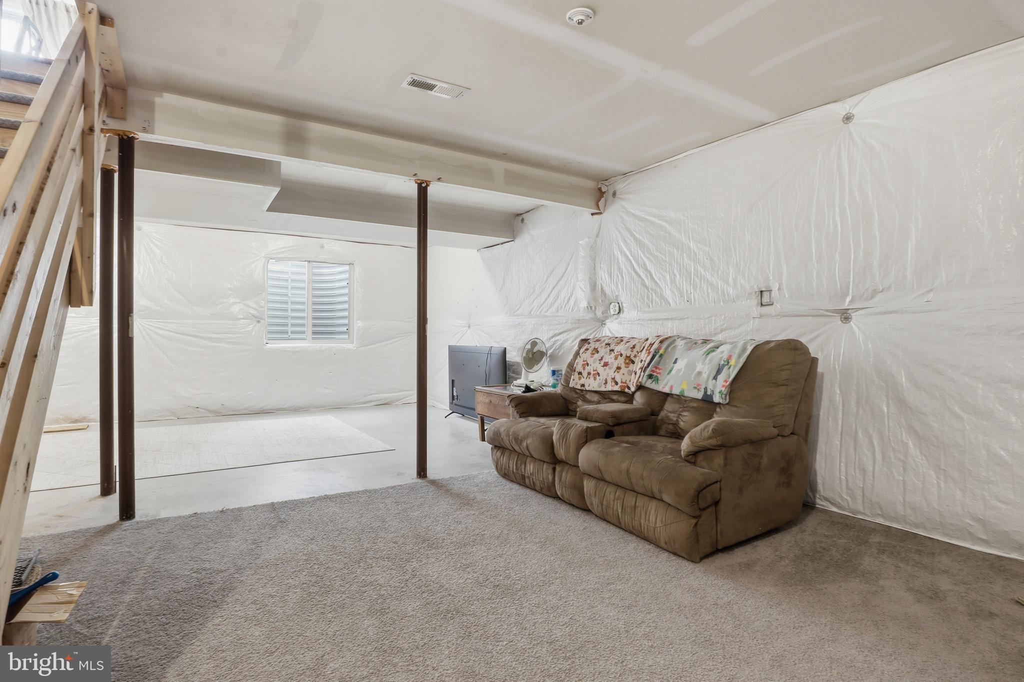 6083 Jennifer Lane Spring Grove, PA 17362 - Photo 34 of 61 a living room with furniture and a floor to ceiling window