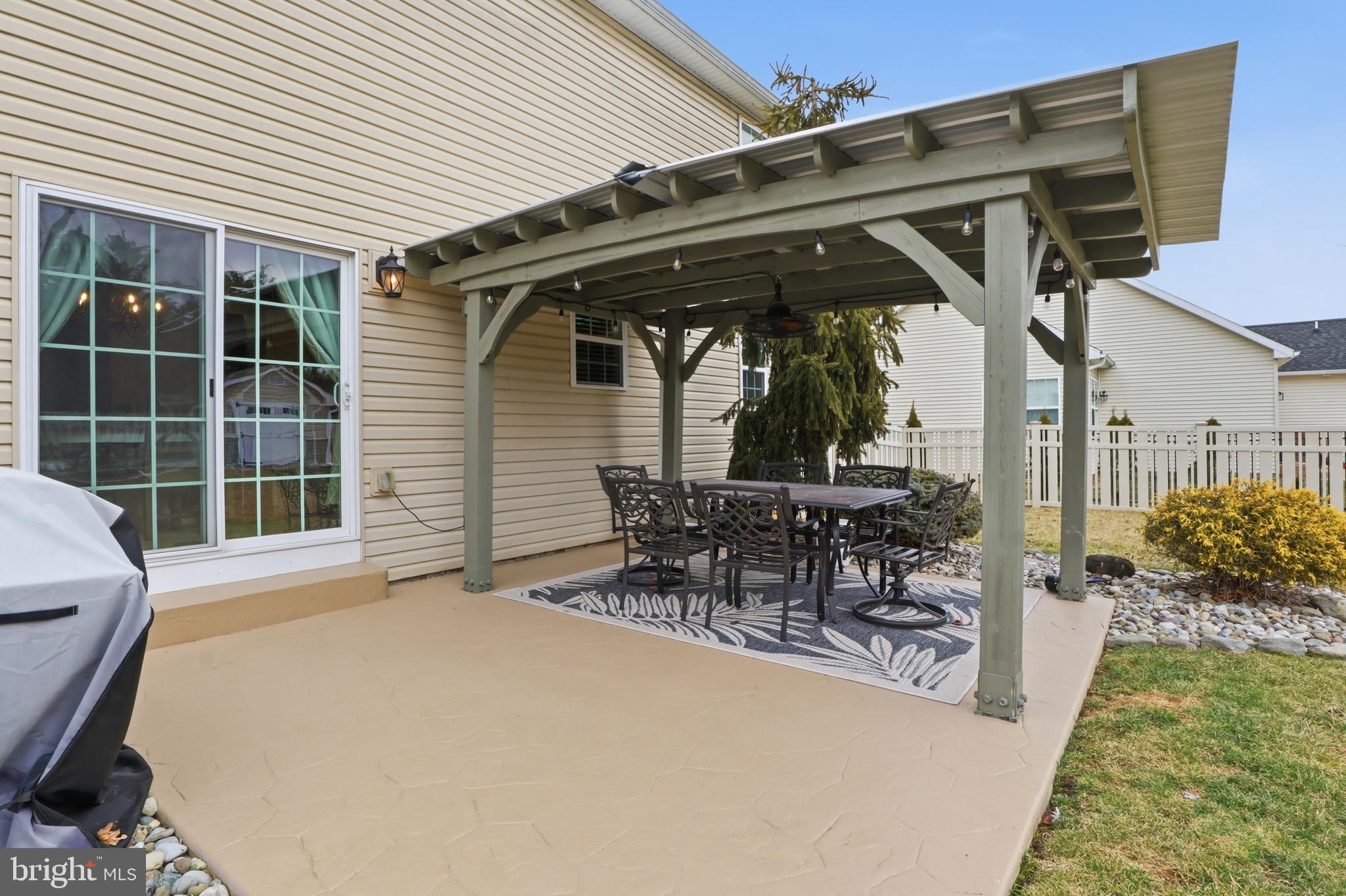 6083 Jennifer Lane Spring Grove, PA 17362 - Photo 37 of 61 a view of a patio with table and chairs with wooden floor and fence