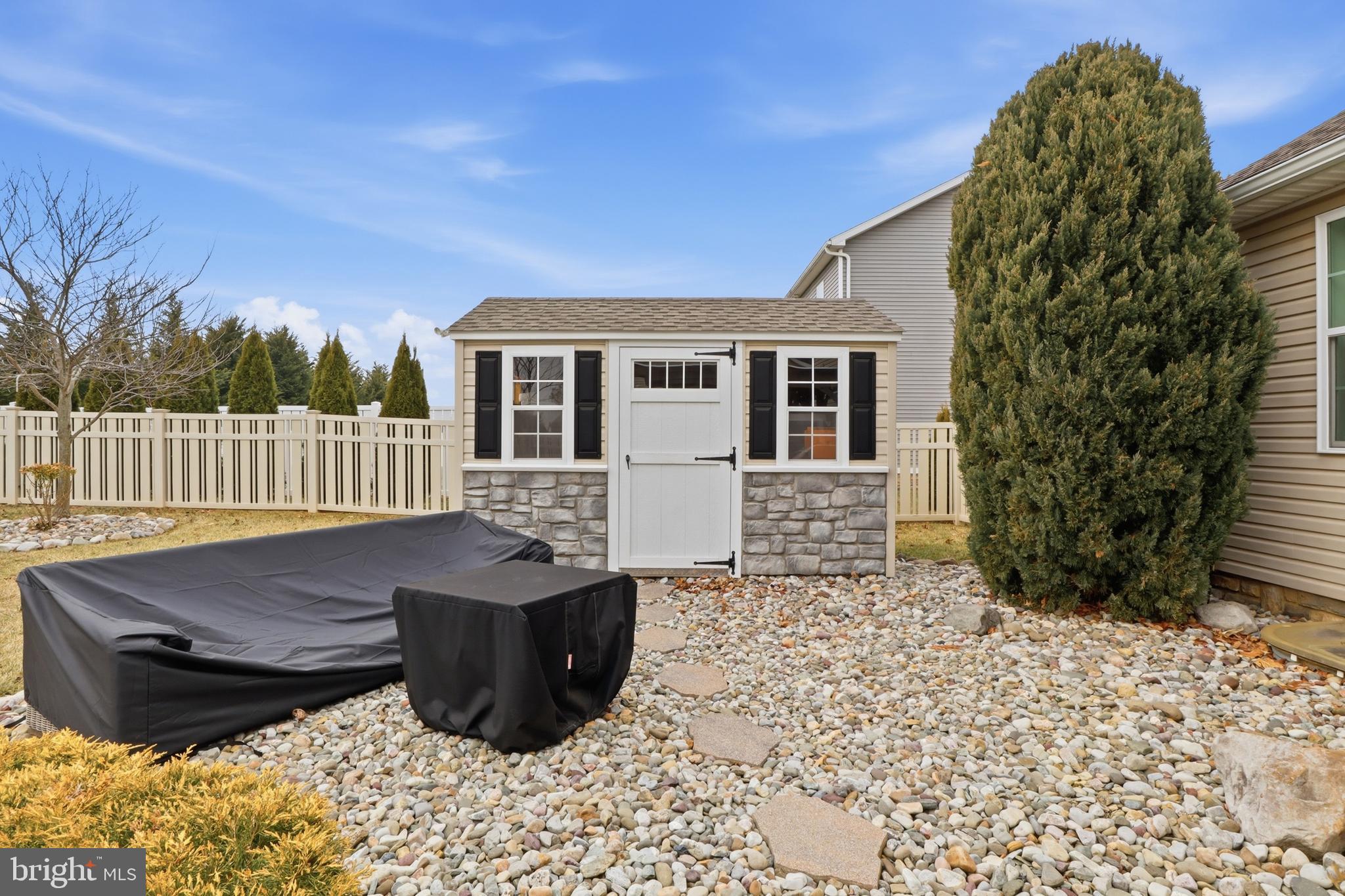 6083 Jennifer Lane Spring Grove, PA 17362 - Photo 38 of 61 a view of a porch with a bench