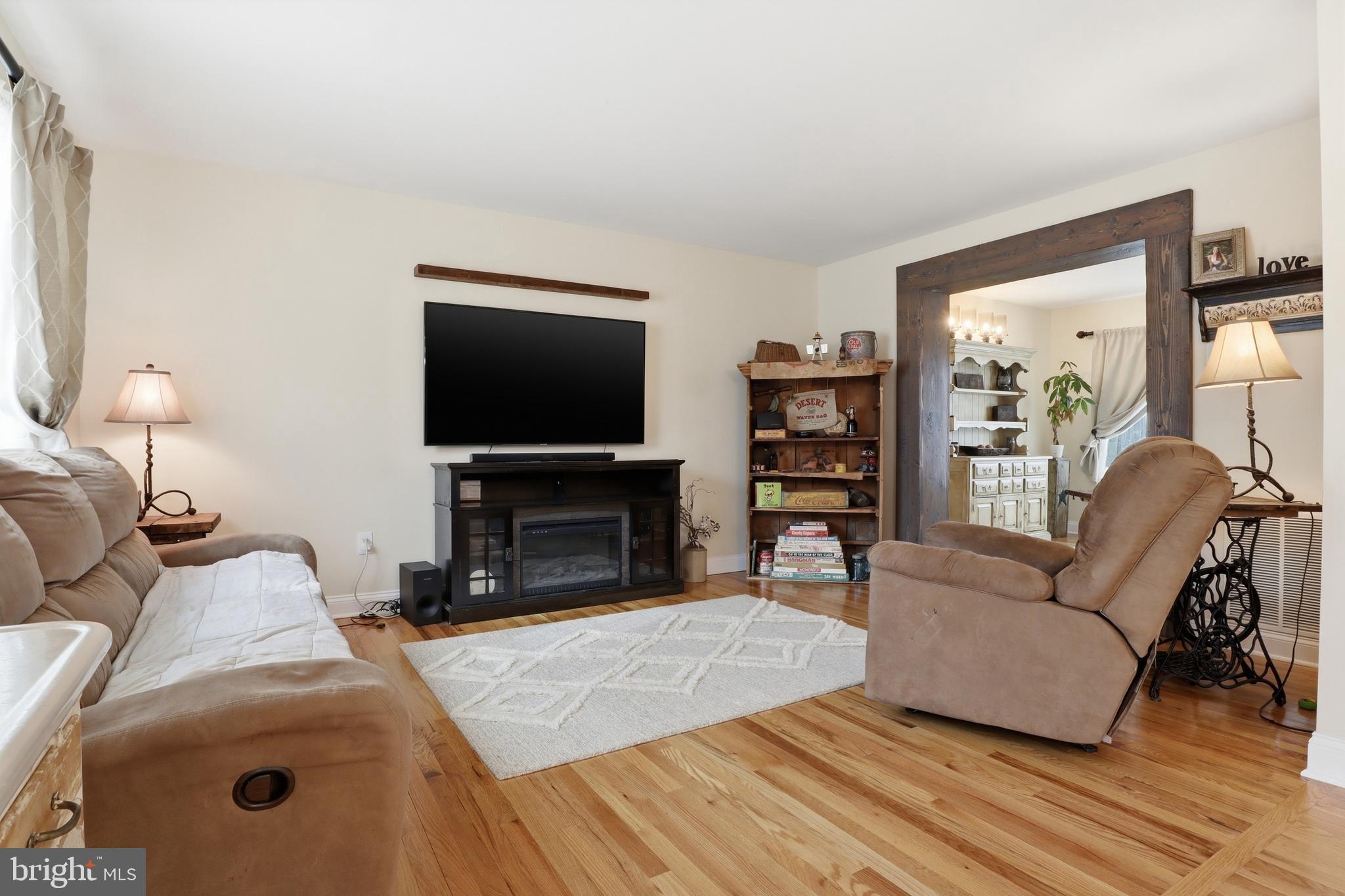 6083 Jennifer Lane Spring Grove, PA 17362 - Photo 9 of 61 a living room with furniture and a fireplace