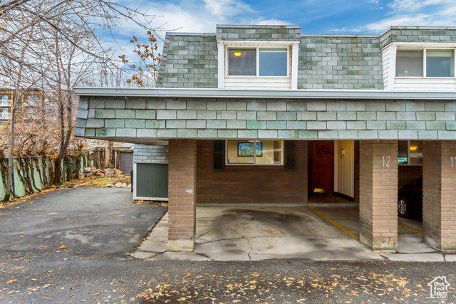 200 Maple Street, Unit 12 Murray, UT 84107 - Photo 1 of 1 Exterior space featuring a carport