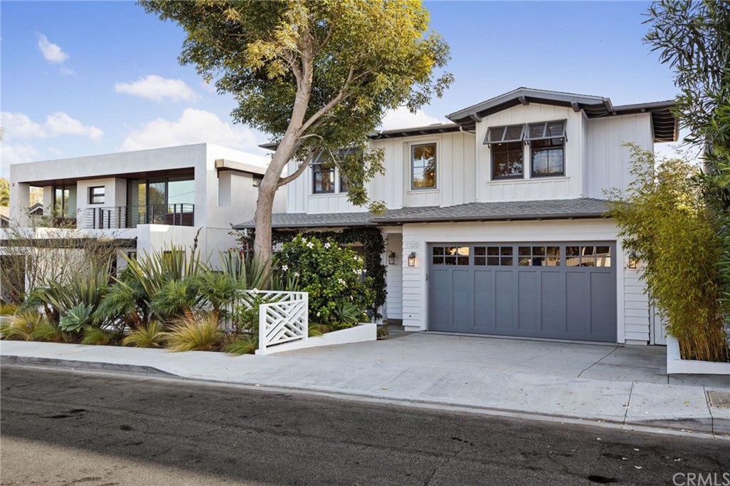 1120 6th Street Manhattan Beach, CA 90266 - Photo 2 of 64 a front view of a house with a yard and garage