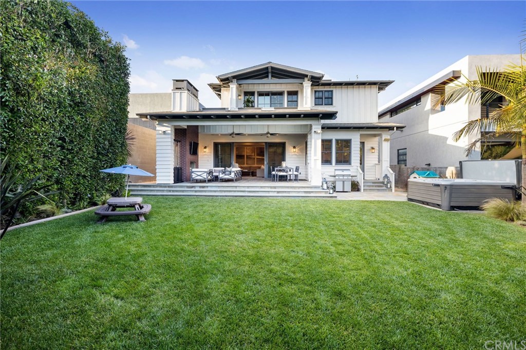 1120 6th Street Manhattan Beach, CA 90266 - Photo 28 of 64 a front view of a house with a garden and sitting area