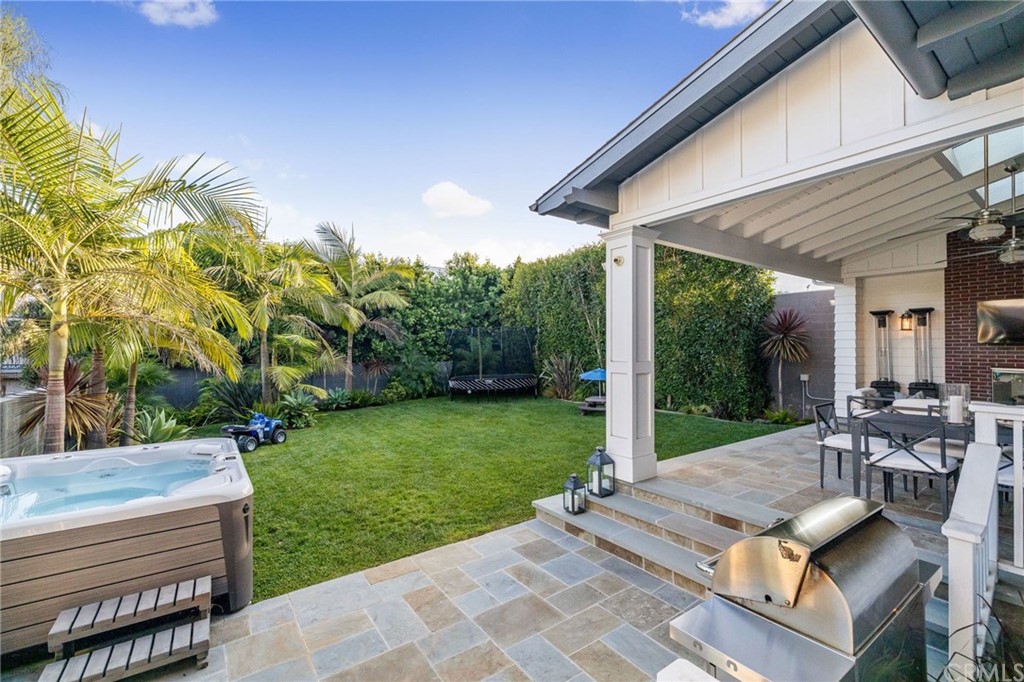 1120 6th Street Manhattan Beach, CA 90266 - Photo 29 of 64 a view of a patio with lawn chairs floor to ceiling window and garden