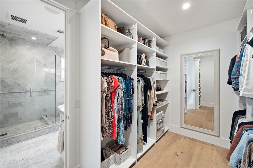 1120 6th Street Manhattan Beach, CA 90266 - Photo 40 of 64 a view of walk in closet with clothes and shoes