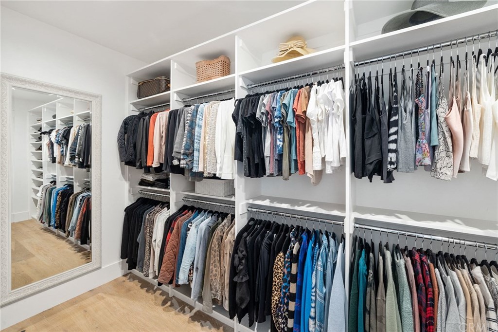 1120 6th Street Manhattan Beach, CA 90266 - Photo 41 of 64 a view of walk in closet with clothes and shoes