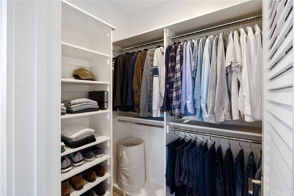 1120 6th Street Manhattan Beach, CA 90266 - Photo 44 of 64 a view of walk in closet with clothes and shoes