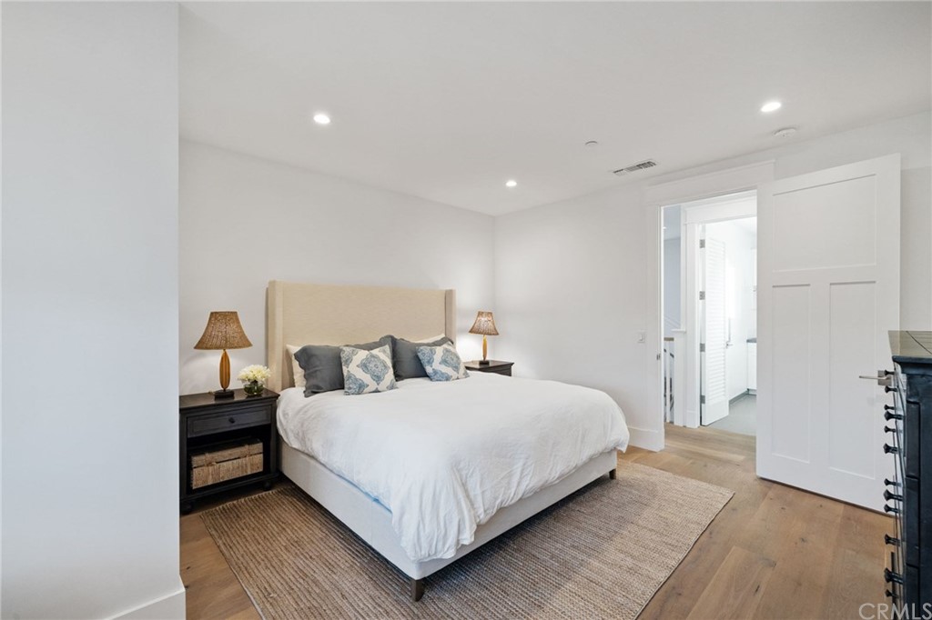 1120 6th Street Manhattan Beach, CA 90266 - Photo 54 of 64 a bedroom with a bed and a night stand