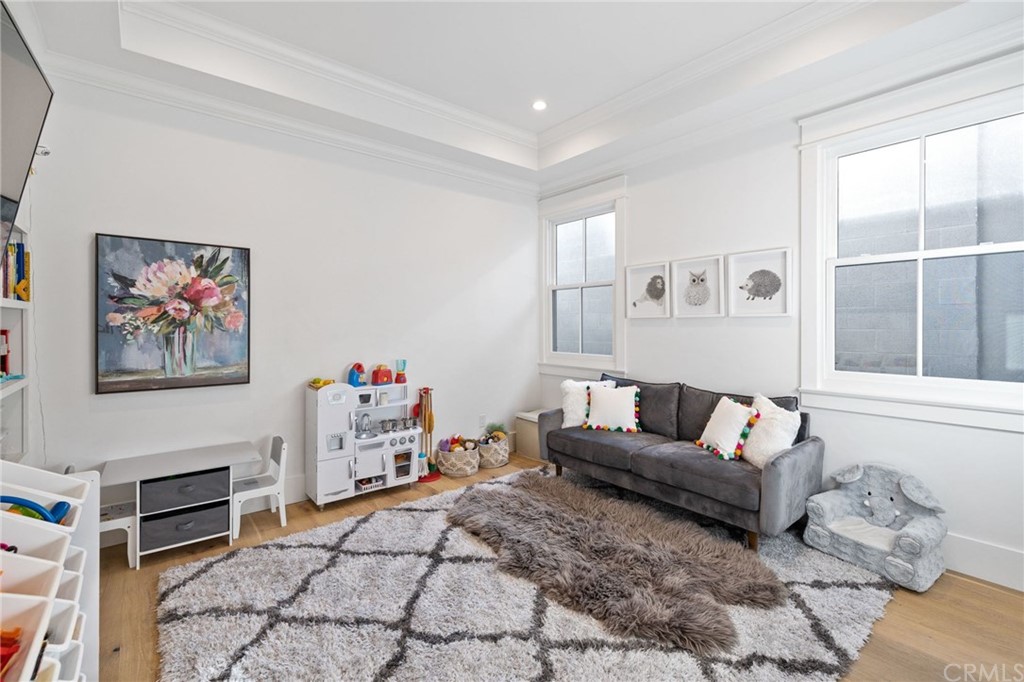 1120 6th Street Manhattan Beach, CA 90266 - Photo 59 of 64 a living room with furniture and a flat screen tv