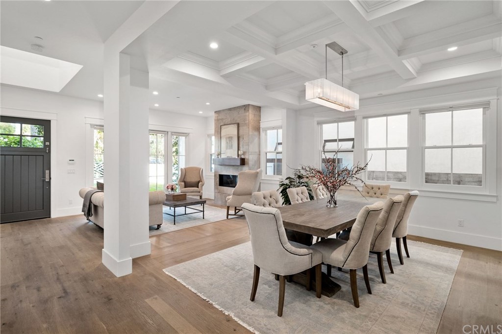 1120 6th Street Manhattan Beach, CA 90266 - Photo 6 of 64 a view of a dining room with furniture and a chandelier