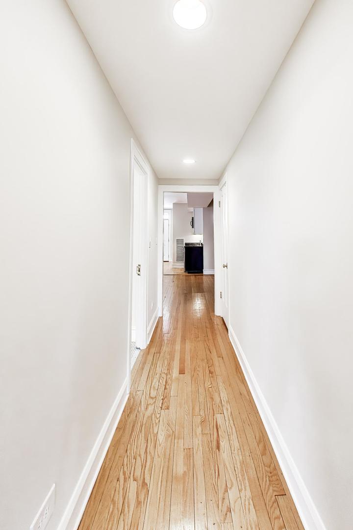 1734 West Foster Avenue, Unit 1 Chicago, IL 60640 - Photo 14 of 24 a view of a living room with wooden floor