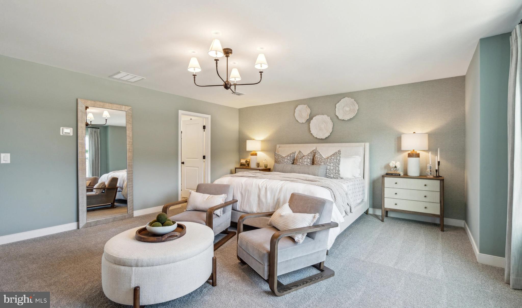 (lot 425-tbd Lot 425-tbd Street Ranson, WV 25438 - Photo 11 of 29 a bedroom with furniture and a chandelier