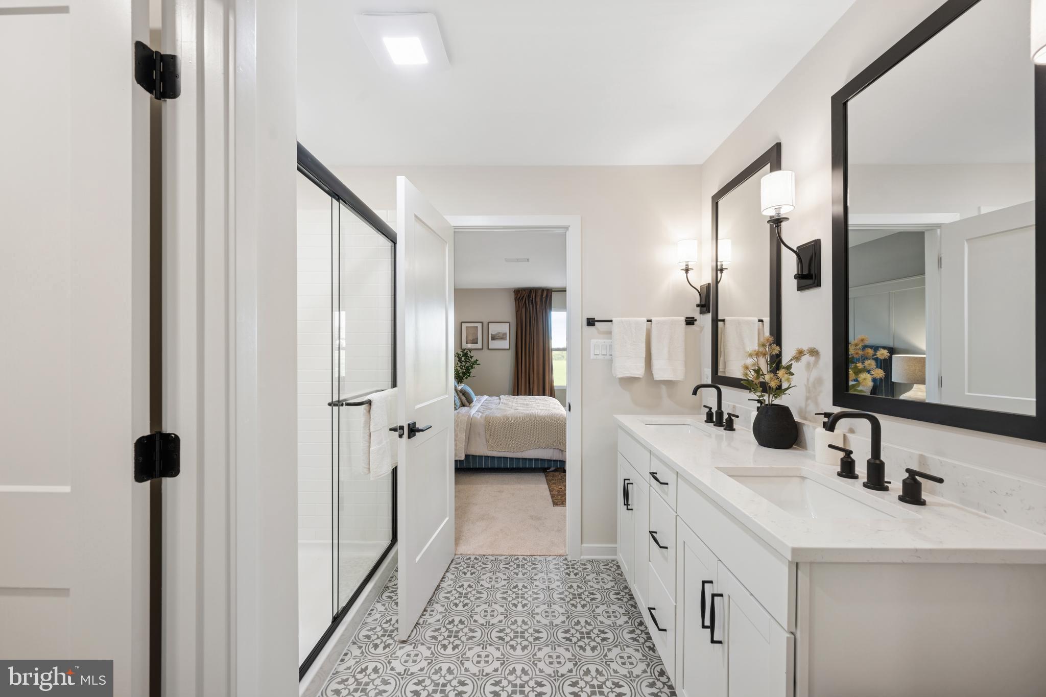 (lot 425-tbd Lot 425-tbd Street Ranson, WV 25438 - Photo 20 of 29 a spacious bathroom with a double vanity sink mirror and shower