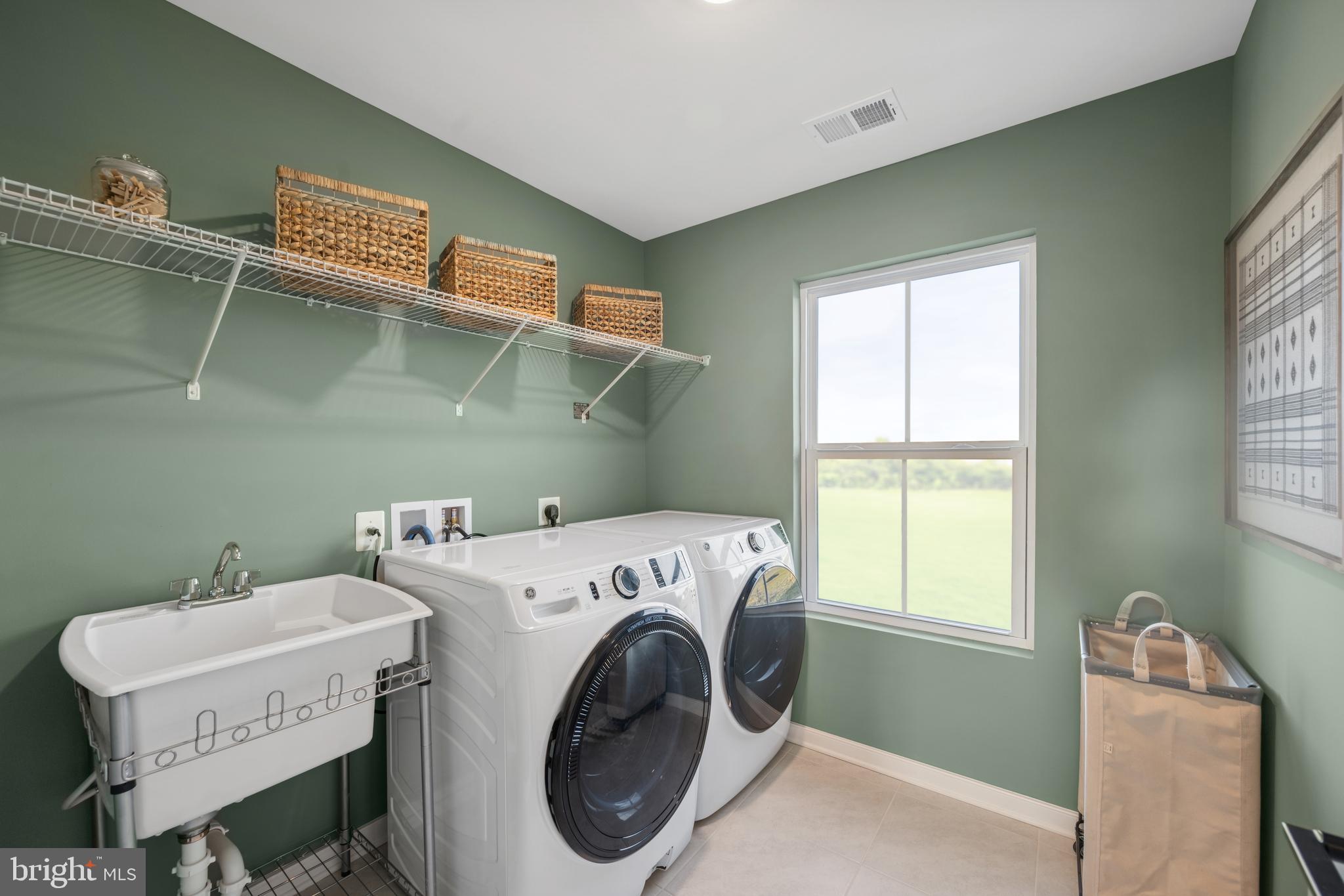 (lot 425-tbd Lot 425-tbd Street Ranson, WV 25438 - Photo 28 of 29 a utility room with dryer and washer