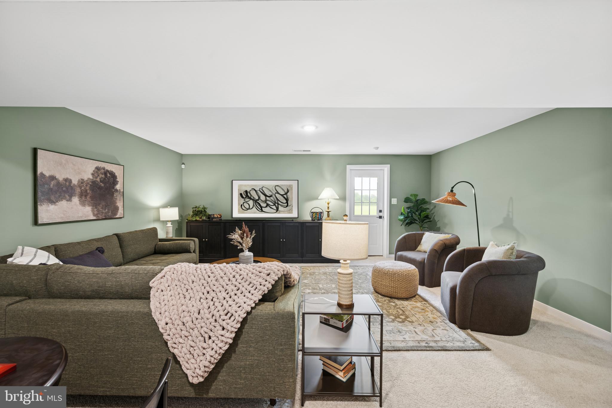 (lot 425-tbd Lot 425-tbd Street Ranson, WV 25438 - Photo 29 of 29 a living room with furniture two windows and a fireplace