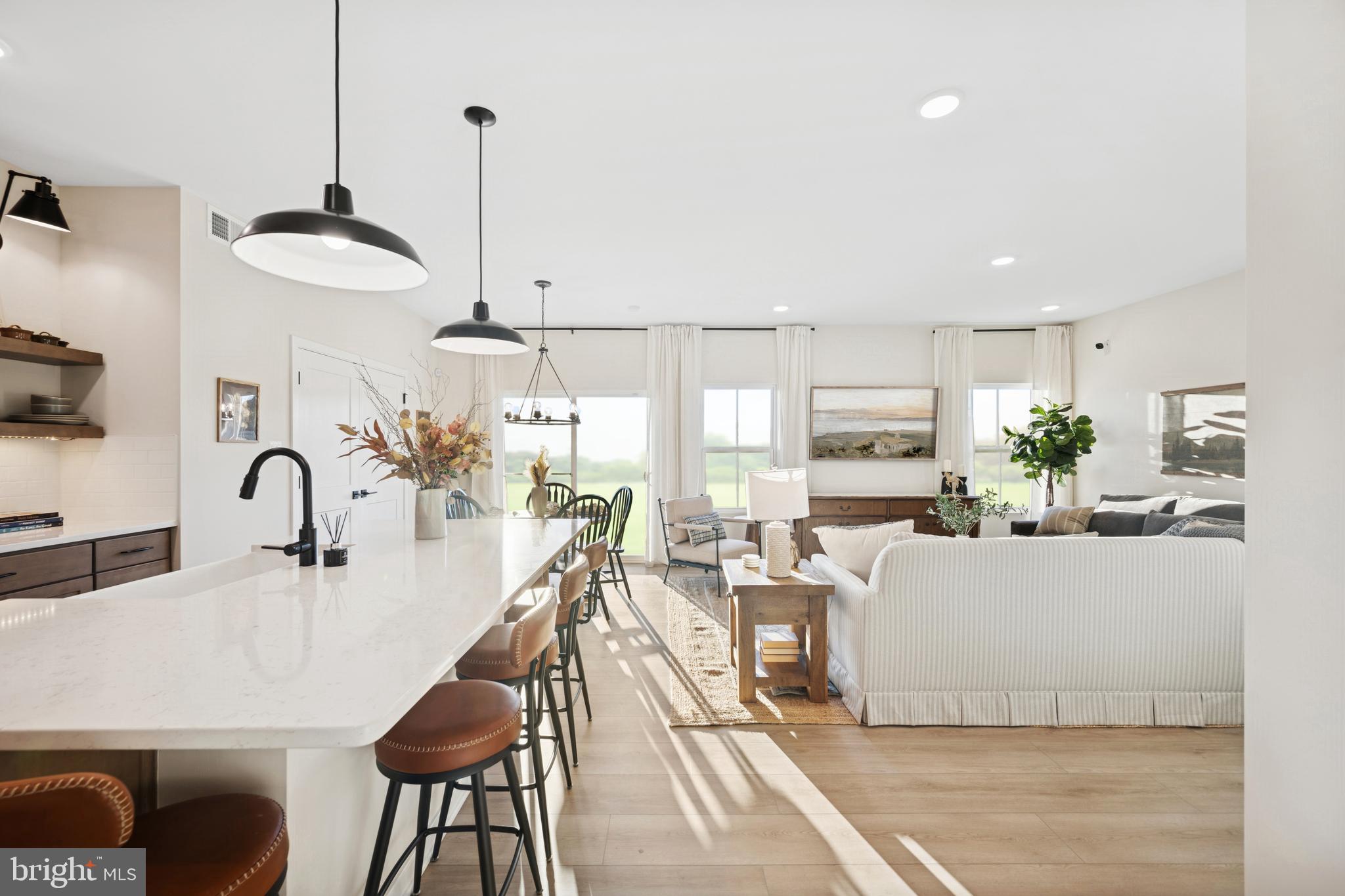 (lot 425-tbd Lot 425-tbd Street Ranson, WV 25438 - Photo 9 of 29 a dining room with furniture and wooden floor