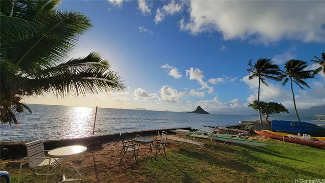 a view of swimming pool with a table and chairs