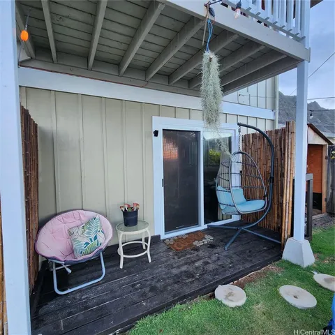 a view of a porch with furniture
