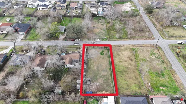 a small pool that has a tree and a yard