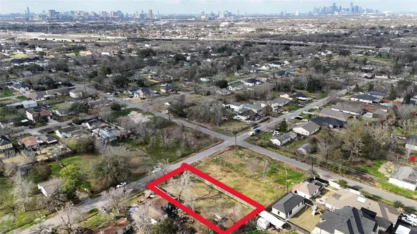 an aerial view of red and white house