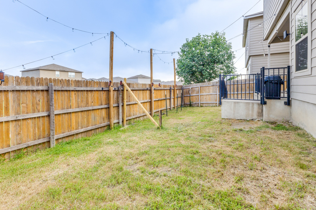 444 Major Lee Lane, Unit 14H Jarrell, TX 76537 - Photo 22 of 22 a house with a yard
