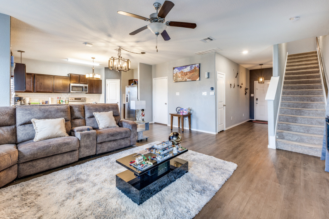444 Major Lee Lane, Unit 14H Jarrell, TX 76537 - Photo 3 of 22 a living room with furniture and a wooden floor
