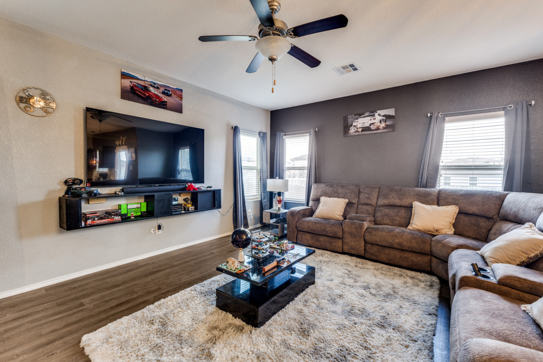 444 Major Lee Lane, Unit 14H Jarrell, TX 76537 - Photo 4 of 22 a living room with furniture and a flat screen tv