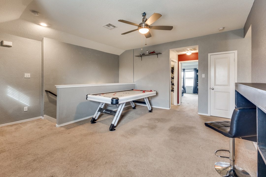 444 Major Lee Lane, Unit 14H Jarrell, TX 76537 - Photo 8 of 22 a view of a room with gym equipment