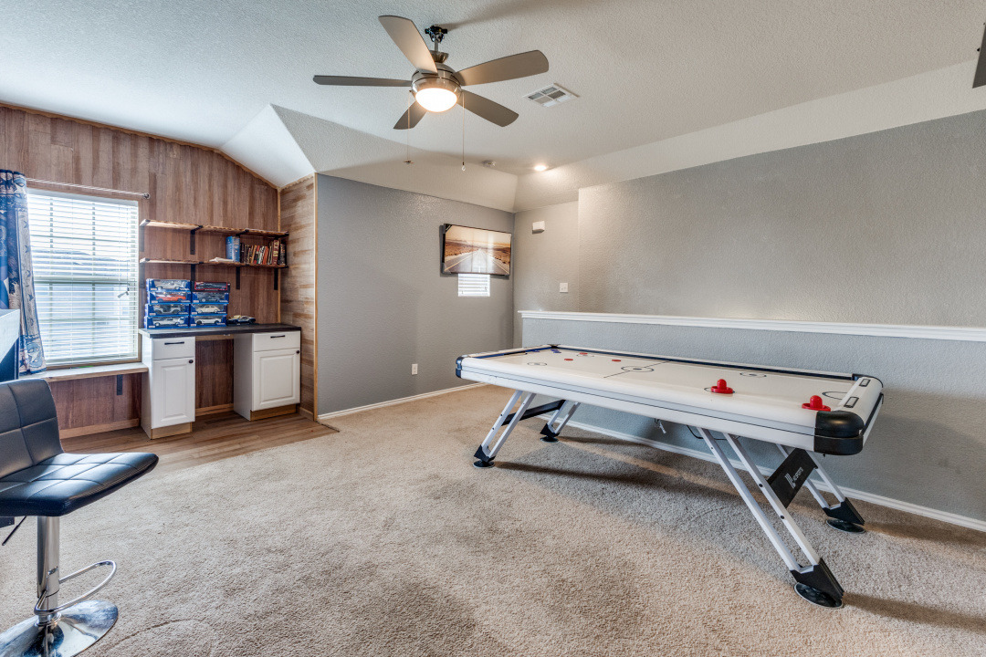 444 Major Lee Lane, Unit 14H Jarrell, TX 76537 - Photo 10 of 22 a room with gym equipment