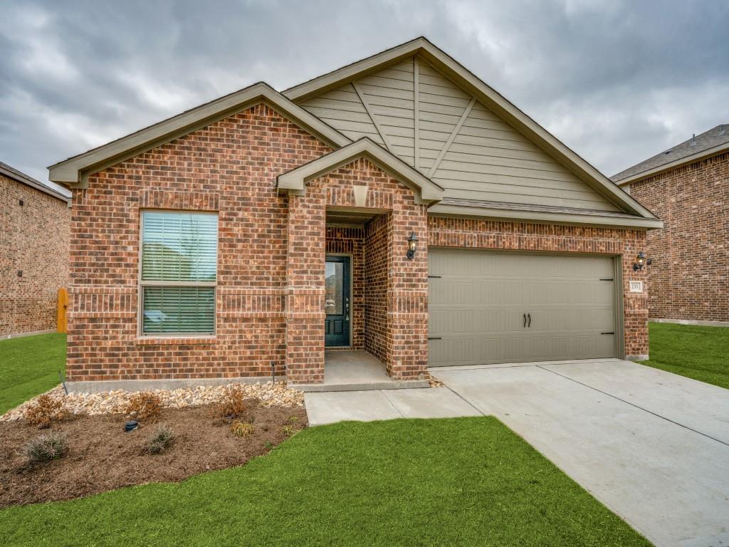 233 Enchanted Way Princeton, TX 75407 - Photo 2 of 25 a front view of a house with a yard and garage