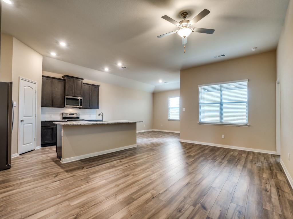 233 Enchanted Way Princeton, TX 75407 - Photo 6 of 25 a view of kitchen with sink microwave and refrigerator