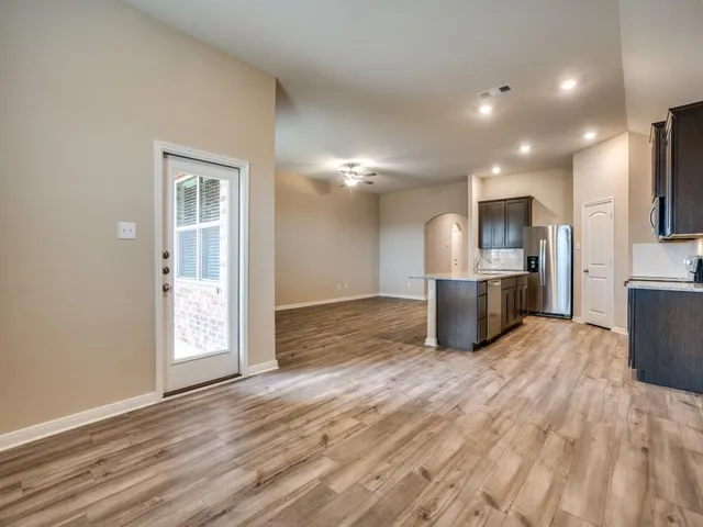 a view of kitchen with wooden floor
