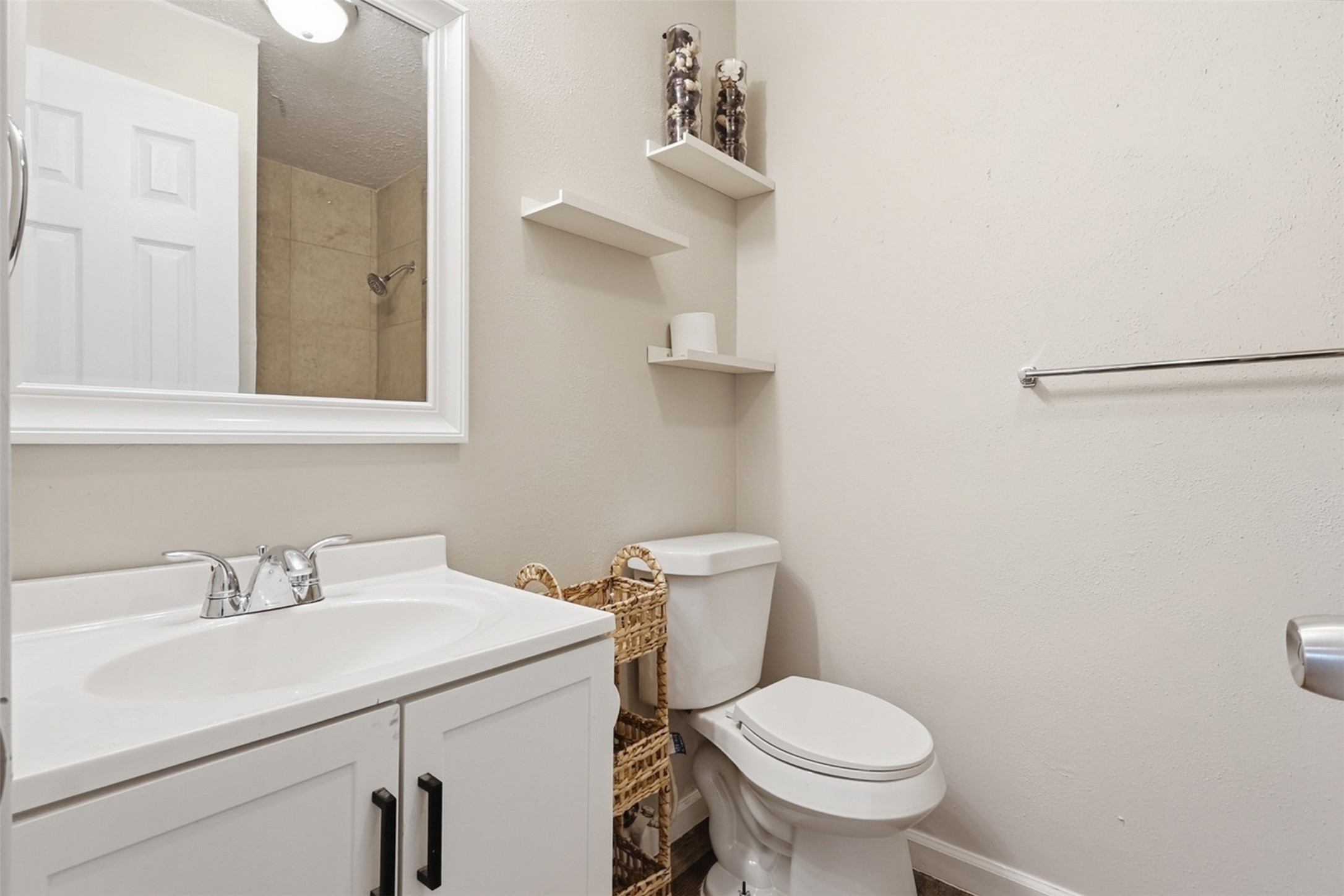 4767 Beechaven Street Houston, TX 77053 - Photo 24 of 26 a bathroom with a sink toilet and a mirror
