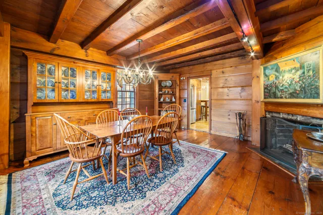 a dining room with furniture and wooden floor