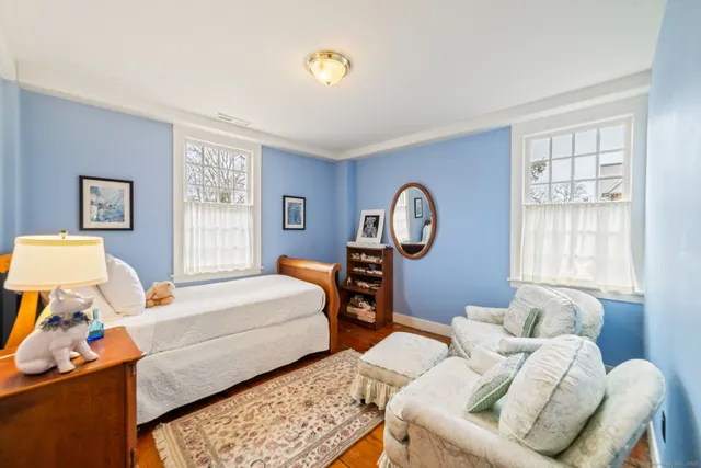 a bedroom with furniture and a window