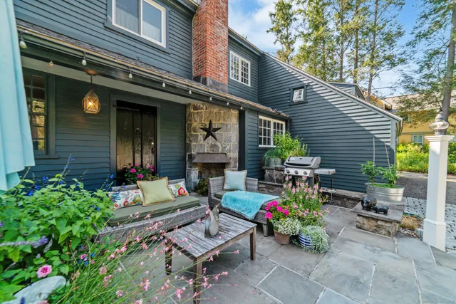 a view of a chairs and table in a patio