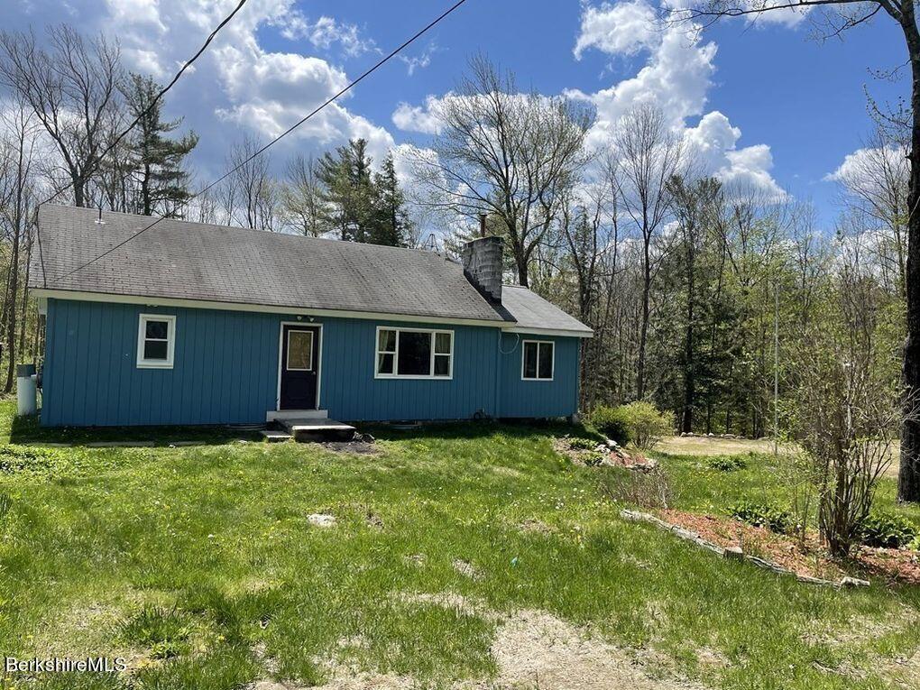 33 Beach Road Becket, MA 01223 - Photo 1 of 1 a backyard of a house with lots of green space